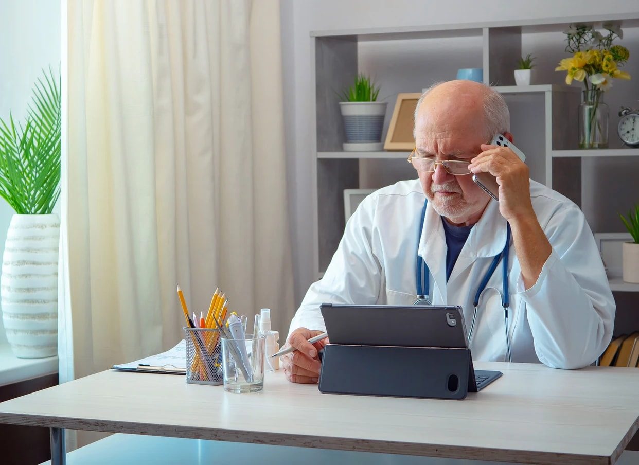 A clinician reviewing an authorization on a tablet