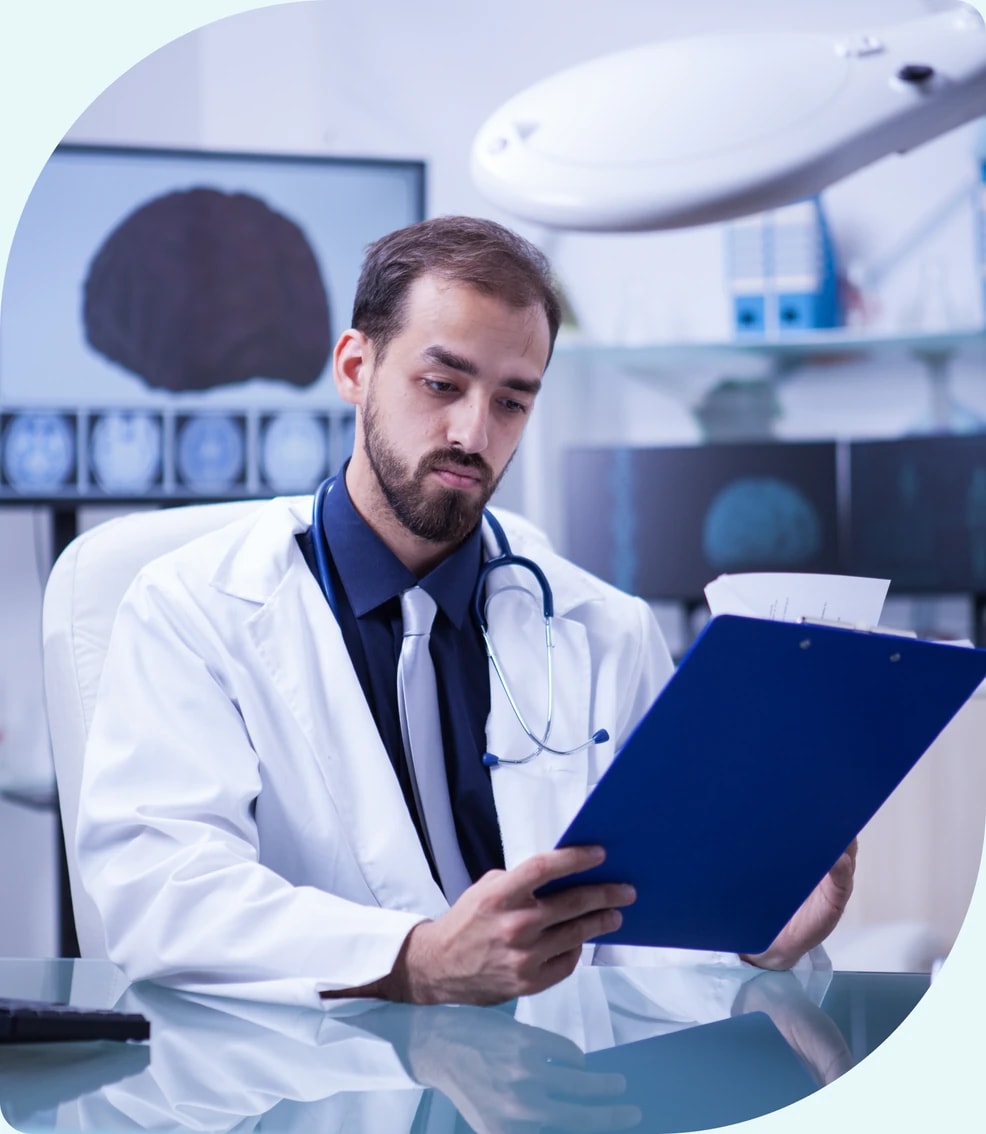 Behavioral health clinician reviewing imaging and case notes