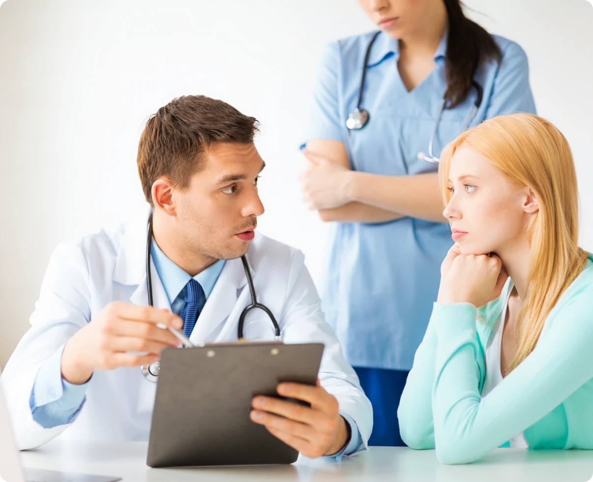 A behavioral health provider reviewing billing with colleagues and a patient