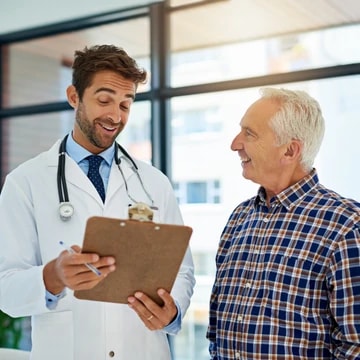 A provider reviewing a chart with a patient