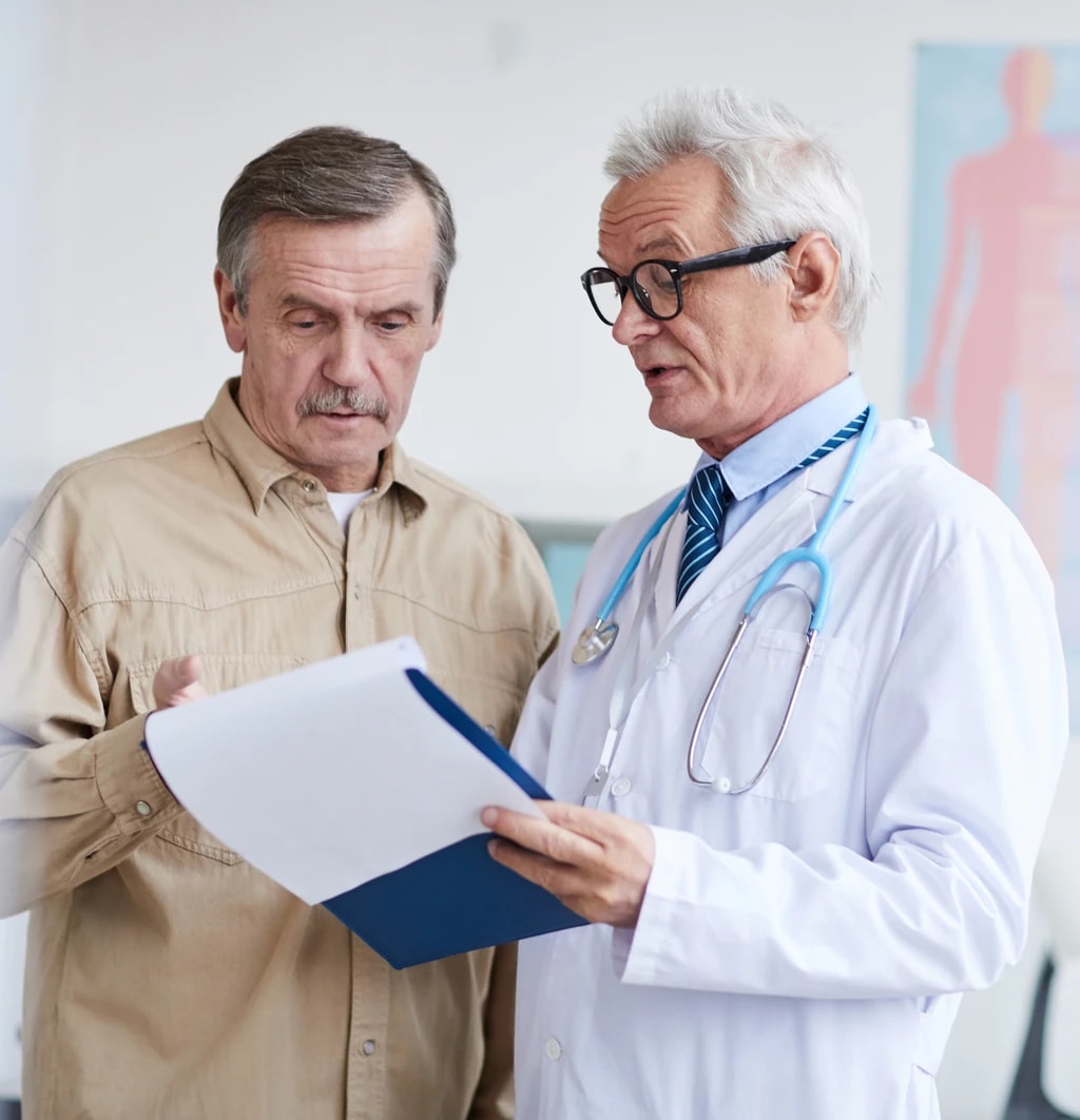A facility clinician reviewing a treatment plan with a patient