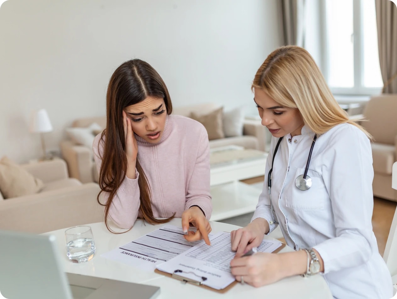 A psychiatrist reviewing notes with a patient